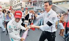  ??  ?? Power duo: Lewis Hamilton and Toto Wolff celebrate after winning in Monaco in May