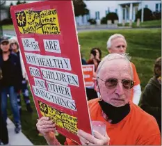  ?? Eduardo Munoz Alvarez / Associated Press ?? People march at the end of a vigil to stand with the Uvalde families and demanding to end gun violence on Thursday in Newtown.