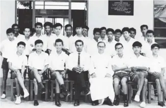  ?? ?? The Form 5 boys of St Thomas’ Secondary School’s ‘Class of 1967’, with Canon Wellington (seated, fourth right) and Mohideen (seated, fourth le ). The columnist could be seen on the si ing row, second le .