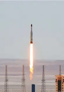  ?? AFP-Yonhap ?? A handout picture released by Iran’s defense ministry Thursday shows a Simorgh (Phoenix) satellite rocket lifting off during launch at an undisclose­d location in Iran.