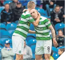  ??  ?? Mikael Lustig and Scott Brown celebrate at an emptying Ibrox back in April.