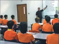  ?? NELSON ALMEIDA / AFP ?? Chinese players from CSL club Shandong Luneng receive Portuguese lessons in a school at their Brazilian training base in Porto Feliz.
