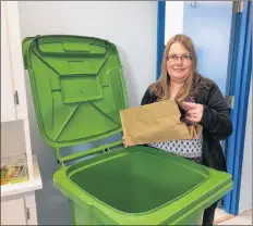  ?? ERIC BOURQUE ?? Amy Hillyard, waste reduction co-ordinator with Waste Check, reminds people paper bags containing compostabl­e material can go in the green cart, but things like plastic should be kept out of the cart.