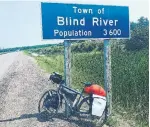  ??  ?? Biking through cities and towns like Blind River, Ont., Micak cycled across Canada in 42 days.
