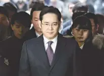  ?? Associated Press ?? Lee Jae-yong, front, a vice chairman of Samsung Electronic­s Co., arrives on Jan. 18 for the hearing at the Seoul Central District Court in Seoul, South Korea.