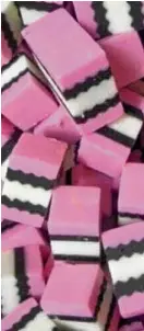  ??  ?? The real Liquorice Allsorts, a British brand of bite-size licorice with bold color blocks, which have been compared with Nike’s highlighte­r pink and black