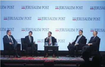  ?? (Marc Israel Sellem/The Jerusalem Post) ?? DR. EFRAIM CHALAMISH (center) moderates a panel discussion at the Jerusalem Post Annual Conference in New York City on Sunday.