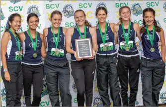  ?? Courtesy art ?? Saugus girls cross-country team poses after finishing in first place out of the large schools with a team average of 19:34.02 seconds in the 3-mile run.