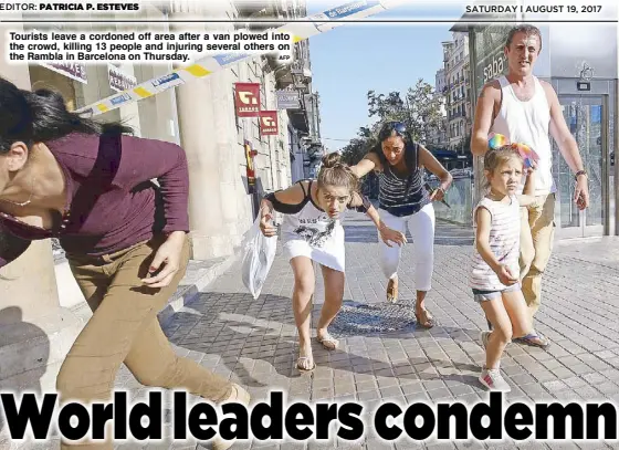  ?? AFP ?? Tourists leave a cordoned off area after a van plowed into the crowd, killing 13 people and injuring several others on the Rambla in Barcelona on Thursday.