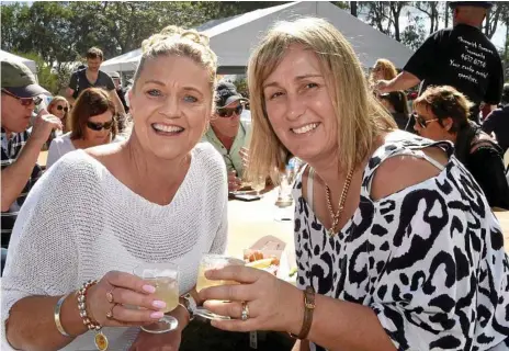  ?? Photo: Bev Lacey ?? TASTY FESTIVAL: Sharon Wilkinson (left) and Karen Griffiths enjoy some music in the sunshine at the 2017 Hampton Festival.