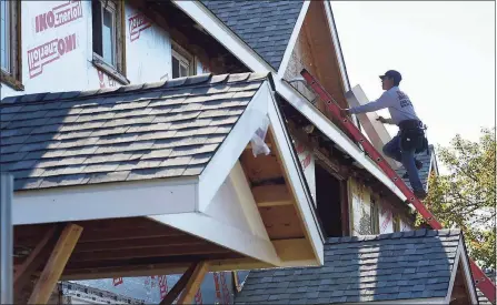  ?? Erik Trautmann / Hearst Connecticu­t Media file photo ?? A constructi­on worker renovates a Norwalk home in October. Connecticu­t employers filled more than 51,000 jobs on a net basis in 2021, but remain 71,000 jobs short of levels prior to the COVID-19 pandemic.