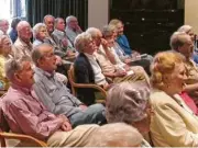  ??  ?? Residents at The Hallmark attend a monthly Fireside Chat to ask questions or voice concerns.
