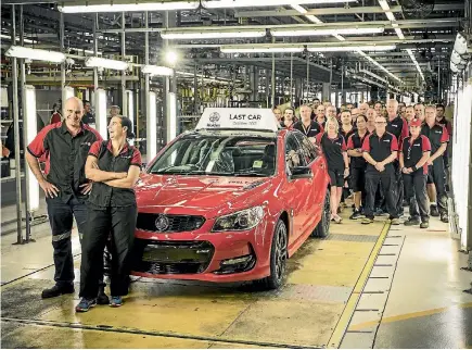  ?? PHOTOS: SUPPLIED ?? Holden employees pose with the last Commodore.