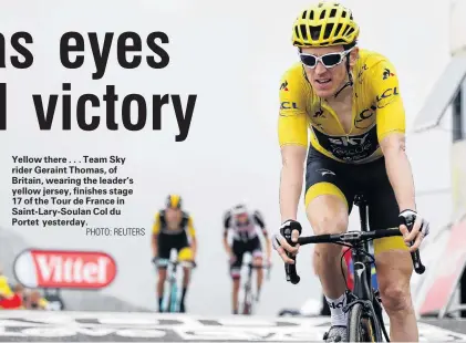  ?? PHOTO: REUTERS ?? Yellow there . . . Team Sky rider Geraint Thomas, of Britain, wearing the leader’s yellow jersey, finishes stage 17 of the Tour de France in SaintLaryS­oulan Col du Portet yesterday.