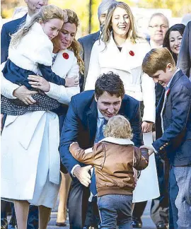  ??  ?? Family comes first: “All my life I had wanted more than anything to become a dad,” said Canada’s new Prime Minister Justin Trudeau (in photo with wife Sophie, daughter Ella-Grace Margaret and sons Hadrien and Xavier James).