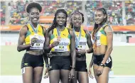  ??  ?? The Jamaican women’s 4x400m team of (from left) Janieve Russell, Anneisha McLaughlin-Whilby, Verone Chambers and Stephenie-Ann McPherson pose with their bronze medals at the IAAF World Relays.