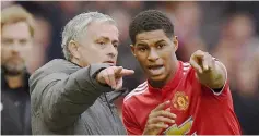  ??  ?? Manchester United’s manager Mourinho talks with Rashford during the Premier League match against Liverpool at the Old Trafford in Manchester. — AFP photo