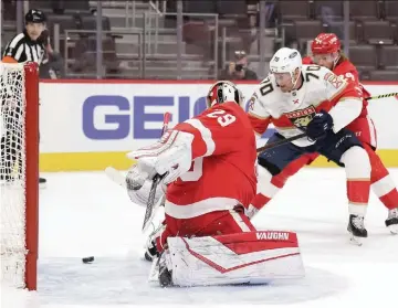  ?? GREGORY SHAMUS Getty Images ?? Patric Hornqvist scores past Red Wings goalie Thomas Greiss in the first period Friday at Little Caesars Arena. It was the first of two goals for the veteran Panthers forward, who has eight goals this season.