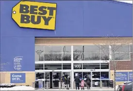  ?? Nam Y. Huh / Associated Press ?? Shoppers enter and exit a Best Buy store in Schaumburg, Ill., on Feb. 6. Best Buy said Thursday that it laid off 5,000 full-time store workers.