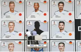  ??  ?? Out...leroy Sane’s image is removed from the DFB’s football museum before the World cup in russia