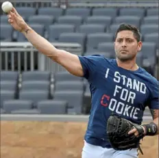  ??  ?? Catcher Francisco Cervelli warms up before catching a simulated game Wednesday at PNC Park with Keone Kela.