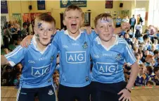  ??  ?? Drimnagh Castle pupils Jamie Nolan (11), Alex Byrne (8) and Nathan Mills (12) in Dublin colours ahead of Sunday’s final
