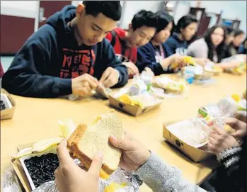  ?? Christina House For The Times ?? STUDENTS EAT UP at Francisco Bravo Medical Magnet High School in L.A. California districts tend to support the rules, but school nutritiona­l directors who oppose them have been embraced by conservati­ves.