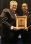  ?? @MAACHOOPS TWITTER PHOTO ?? Rider’s Stella Johnson, right, is presented with the MAAC Player of the Year award by league commission­er Richard J. Ensor, left, during a ceremony on Friday morning in Albany