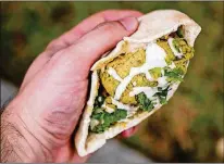  ?? CONTRIBUTE­D BY HENRI HOLLIS ?? Quick Falafel works great in a pita.