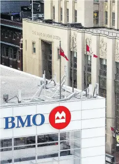 ?? PETER J. THOMPSON / NATIONAL POST ?? The Bank of Montreal’s head offices, left, and the Bank of Nova Scotia’s head offices, right, in Toronto. Both banks reported a strong earnings start to 2018.