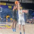  ?? Jon Marks/Special to the Times Union ?? UAlbany's Ny'Mire Little shoots over Drexel's Luke House in their game on Saturday.