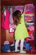  ?? DREAMSTIME ?? Selecting clothes to wear can be difficult for children who may be self-conscious about their size or shape.