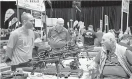  ?? MICHELE EVE SANDBERG/CONTRIBUTO­R ?? A Pembroke Pines gun show draws a crowd Aug. 10 on its first day.