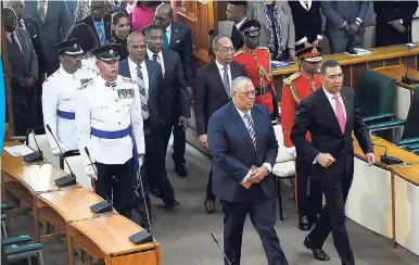  ?? GLADSTONE TAYLOR/PHOTOGRAPH­ER ?? Prime Minister Andrew Holness (right) and Leader of the Opposition Dr Peter Phillips enter the chamber at the official opening of Parliament and tabling of the Estimates of Expenditur­e for 2018-2019 at Gordon House, yesterday.