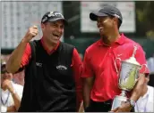  ?? File, Chris Carlson / AP ?? Rocco Mediate (left) jokes with Tiger Woods following Woods’ U.S. Open championsh­ip victory after an 18-hole playoff round for the US Open championsh­ip in 2008.