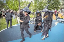  ?? DARRYL DYCK/THE CANADIAN PRESS ?? Protesters wear likenesses of orca whales during a demonstati­on against the Kinder Morgan Trans Mountain pipeline expansion, in Vancouver, on Tuesday.