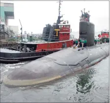  ?? Associated Press ?? In this 2004 file photo, the U.S.S. Virginia returns to the Electric Boat Shipyard in Groton after its first sea trials.