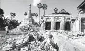  ??  ?? Reuters/Reuters - A man walks near a Buddhist pagoda that was badly damaged by an earthquake in the village of Ma Lar at Kyauk Myaung township