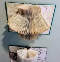  ?? THE ASSOCIATED PRESS ?? Book folding projects hanging on the wall of Candice Caldwell’s Chicago home.