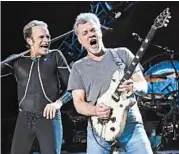  ?? GREG ALLEN/INVISION 2015 ?? Eddie Van Halen, right, performs with David Lee Roth. Van Halen died Tuesday at 65 after a bout with cancer.