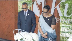 ?? (Jean Bizimana/Reuters) ?? RWANDAN PRESIDENT Paul Kagame and First Lady Jeanette Kagame pay homage before lighting the Rwandan genocide flame of hope, known as the ‘Kwibuka’ (Rememberin­g), to commemorat­e the 1994 Genocide at the Kigali Genocide Memorial Center, yesterday.