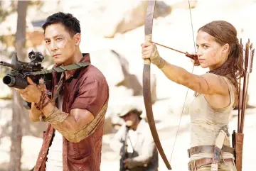  ??  ?? Daniel with co-star Vikander in ‘Tomb Raider’.