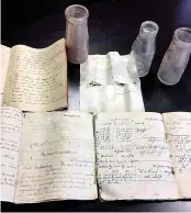  ??  ?? Books and bottles found in the 1947 time capsule hidden by Doug, pictured far right with daughter Karen and grandson Sam, who are both at his old school in Paignton, Devon