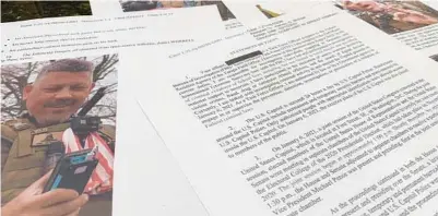  ?? JON ELSWICK/AP FILE ?? This photo shows part of the Justice Department’s statement of facts in the complaint and arrest warrant for Christophe­r Worrell. Worrell, a member of the Proud Boys extremist group who went on the run after he was convicted of assaulting police with pepper spray in the Jan. 6 attack at the U.S. Capitol and then allegedly faked a drug overdose after he was caught, was sentenced to 10 years in prison on Thursday.