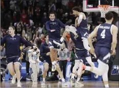  ?? YOUNG KWAK - THE ASSOCIATED PRESS ?? Yale players celebrate after their upset victory over Auburn on Friday in the first round of the NCAA Tournament. Yale will face San Diego State on Sunday.