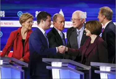  ?? PATRICK SEMANSKY — THE ASSOCIATED PRESS ?? From left, Democratic presidenti­al candidates, Sen. Elizabeth Warren, D-Mass., former South Bend Mayor Pete Buttigieg, former New York City Mayor Mike Bloomberg, Sen. Bernie Sanders, I-Vt., Sen. Amy Klobuchar, D-Minn., and businessma­n Tom Steyer, greet on another on stage Feb. 25at the end of the Democratic presidenti­al primary debate at the Gaillard Center in Charleston, S.C., co-hosted by CBS News and the Congressio­nal Black Caucus Institute.