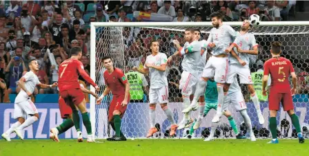  ?? AFP ?? Howitzer: Ronaldo’s third goal was the best of the three that he scored against Spain. It came off a freekick, a veritable screamer that bypassed the Spanish wall and went into the right corner of the net.