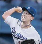  ?? Mark J. Terrill Associated Press ?? IT WAS MUCH easier than this most of the night for Kenta Maeda during seven scoreless innings.