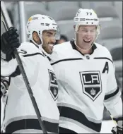  ?? Associated Press ?? FAREWELL Los Angeles Kings left wing Andreas Athanasiou (22) celebrates with center Jeff Carter (77) after scoring a goal against the San Jose Sharks on Saturday in San Jose. Carter was traded to the Penguins after nine seasons with the Kings.