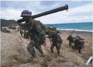  ?? Jung Yeon-je / AFP / Getty Images 2017 ?? South Korean marines participat­e in a military exercise with U.S. forces in Pohang in 2017.